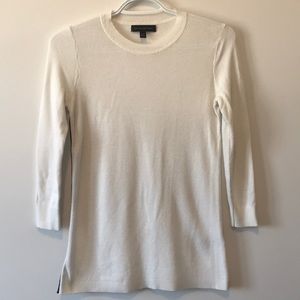 White sweater with black tuxedo stripe detail